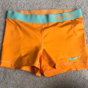 Orange Nike pro shorts